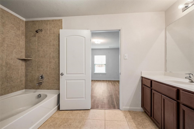1206 Lombardy Dr, Princeton, TX 75407 - bathroom featuring vanity, tub / shower combination, tile patterned floors, and baseboards