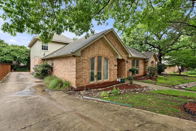 5206 Independence Ave, Arlington, TX 76017 - view of front of house featuring a shingled roof and brick siding