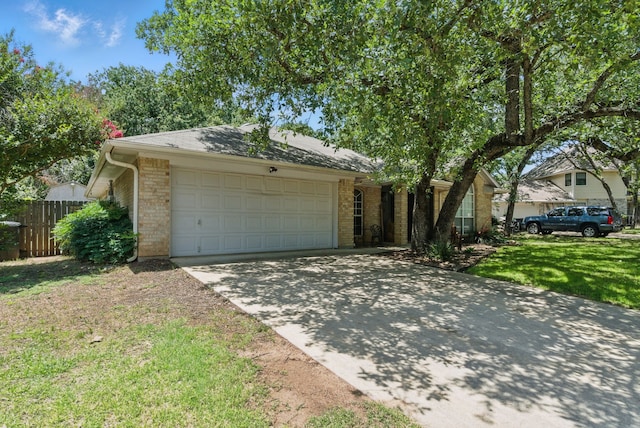 945 Lake Ridge Dr, Azle, TX 76020 - view of front of home featuring driveway, an attached garage, and brick siding