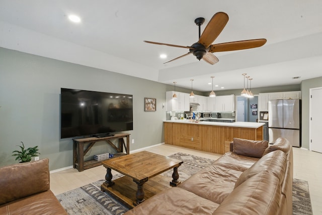 945 Lake Ridge Dr, Azle, TX 76020 - living room with ceiling fan, baseboards, recessed lighting, and light wood-style floors