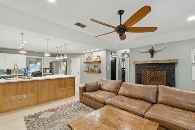 945 Lake Ridge Dr, Azle, TX 76020 - living area with recessed lighting, a ceiling fan, and a fireplace