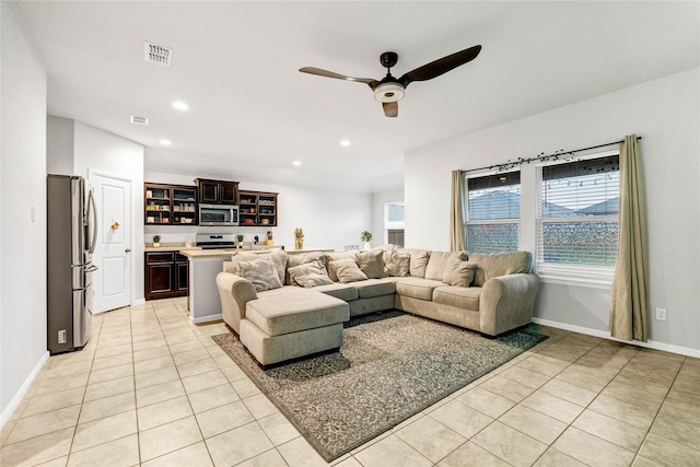 16561 Portage St, Justin, TX 76247 - living room with light tile patterned floors, recessed lighting, ceiling fan, and baseboards