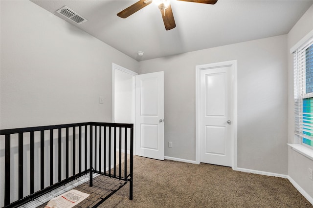 16561 Portage St, Justin, TX 76247 - unfurnished bedroom with carpet floors, baseboards, and a ceiling fan
