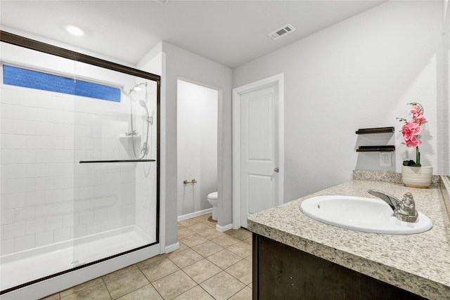 16561 Portage St, Justin, TX 76247 - full bathroom featuring a shower stall, toilet, vanity, tile patterned flooring, and baseboards