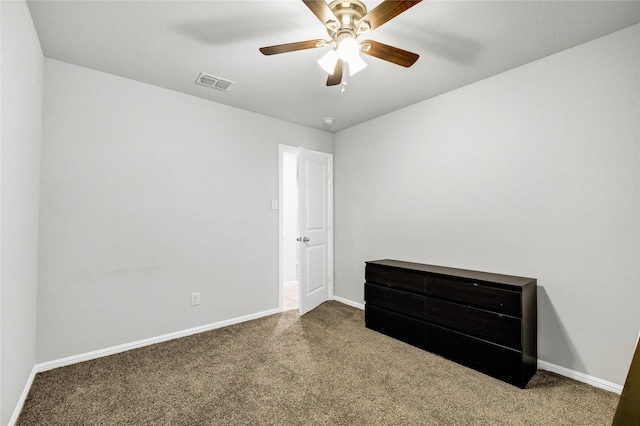 16561 Portage St, Justin, TX 76247 - unfurnished bedroom featuring carpet flooring, baseboards, and ceiling fan