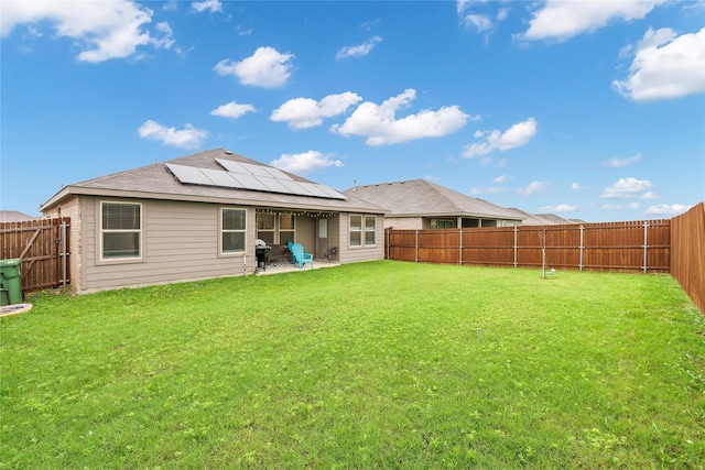 16561 Portage St, Justin, TX 76247 - back of house featuring solar panels and a patio