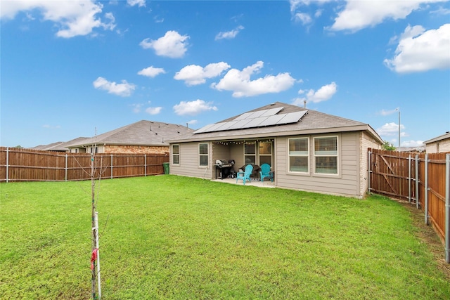 16561 Portage St, Justin, TX 76247 - back of house with solar panels and a patio