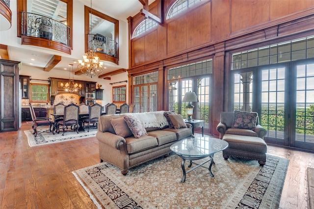 2145 Grand View Ct, Cedar Hill, TX 75104 - living area with a chandelier, a towering ceiling, and wood finished floors