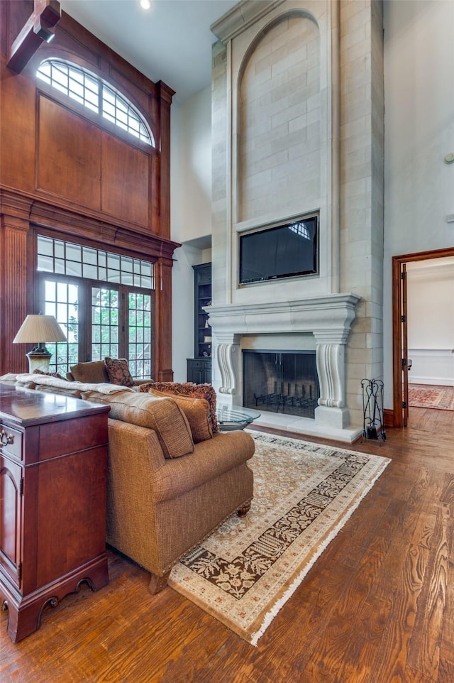2145 Grand View Ct, Cedar Hill, TX 75104 - living area with a high ceiling, a large fireplace, and dark wood-type flooring