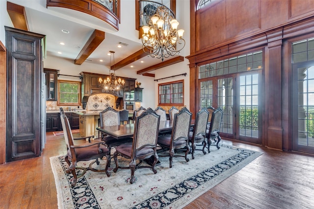 2145 Grand View Ct, Cedar Hill, TX 75104 - dining room with a chandelier, wood finished floors, beamed ceiling, recessed lighting, and a towering ceiling
