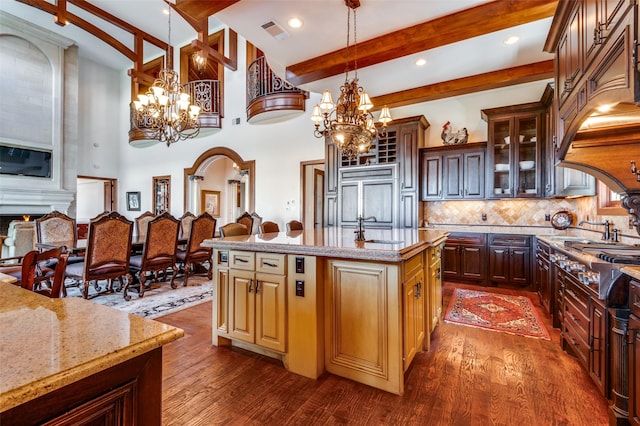 2145 Grand View Ct, Cedar Hill, TX 75104 - kitchen featuring a chandelier, a sink, beamed ceiling, glass insert cabinets, and dark wood-style flooring