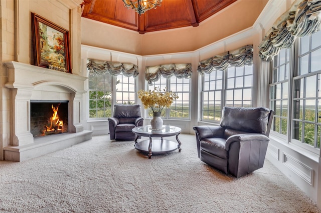 2145 Grand View Ct, Cedar Hill, TX 75104 - living area featuring carpet, plenty of natural light, a lit fireplace, ornamental molding, and a chandelier