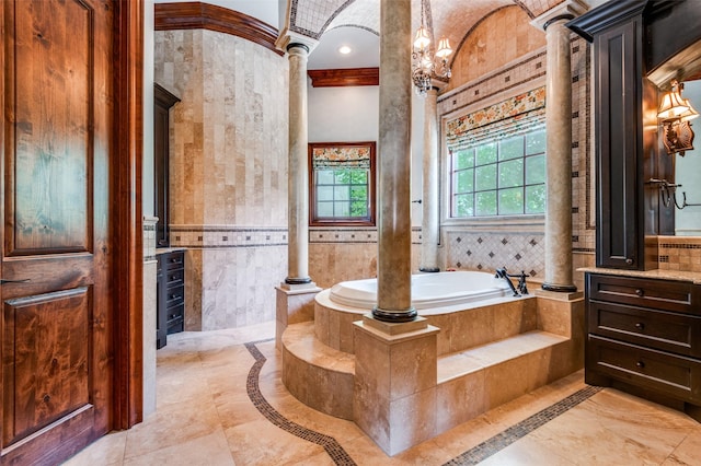 2145 Grand View Ct, Cedar Hill, TX 75104 - full bathroom featuring inlaid floor details, decorative columns, vanity, a garden tub, and a chandelier