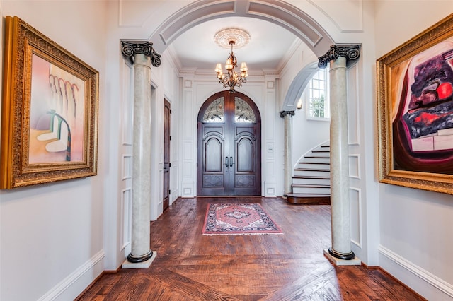 2145 Grand View Ct, Cedar Hill, TX 75104 - entrance foyer featuring arched walkways, a chandelier, stairs, baseboards, and decorative columns