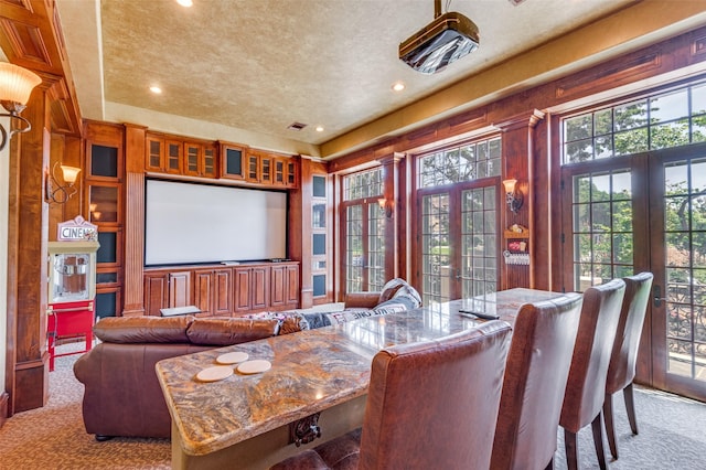 2145 Grand View Ct, Cedar Hill, TX 75104 - carpeted home theater with french doors, plenty of natural light, recessed lighting, and a textured ceiling