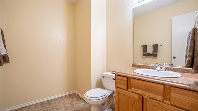 906 Pear Ct, Joshua, TX 76058 - bathroom featuring toilet, vanity, and baseboards