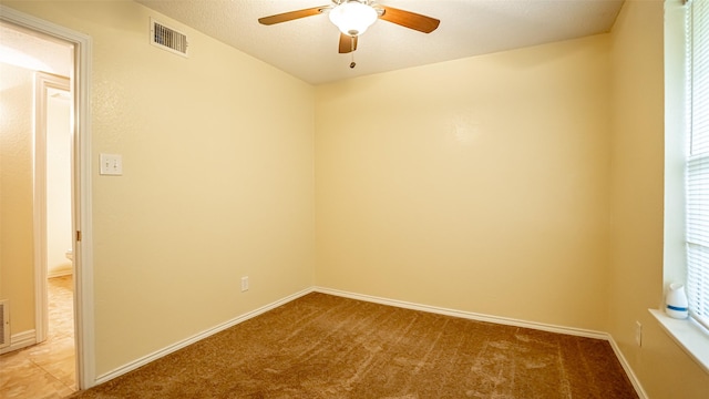 906 Pear Ct, Joshua, TX 76058 - empty room featuring ceiling fan, light colored carpet, and baseboards