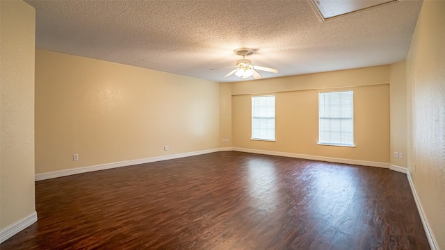 906 Pear Ct, Joshua, TX 76058 - unfurnished room featuring dark wood-style flooring, ceiling fan, a textured ceiling, and baseboards