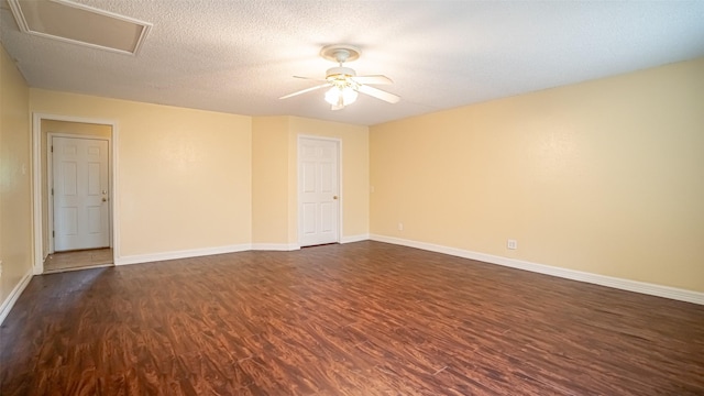 906 Pear Ct, Joshua, TX 76058 - spare room featuring dark wood-type flooring, a ceiling fan, baseboards, and a textured ceiling