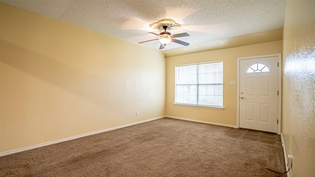 906 Pear Ct, Joshua, TX 76058 - entrance foyer featuring carpet floors, a ceiling fan, a textured ceiling, and baseboards