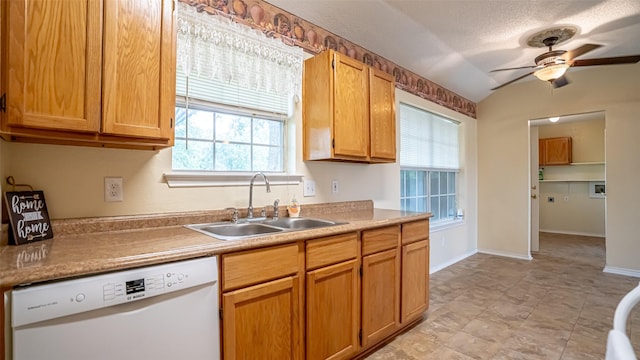 906 Pear Ct, Joshua, TX 76058 - kitchen with dishwasher, a sink, ceiling fan, light countertops, and a textured ceiling