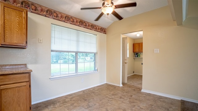 906 Pear Ct, Joshua, TX 76058 - unfurnished dining area featuring a ceiling fan, vaulted ceiling, and baseboards