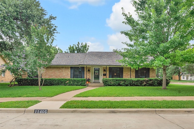 11406 Drummond Dr, Dallas, TX 75228 - single story home with brick siding and a front yard