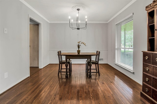 11406 Drummond Dr, Dallas, TX 75228 - dining area featuring a chandelier, dark wood-style flooring, crown molding, and baseboards