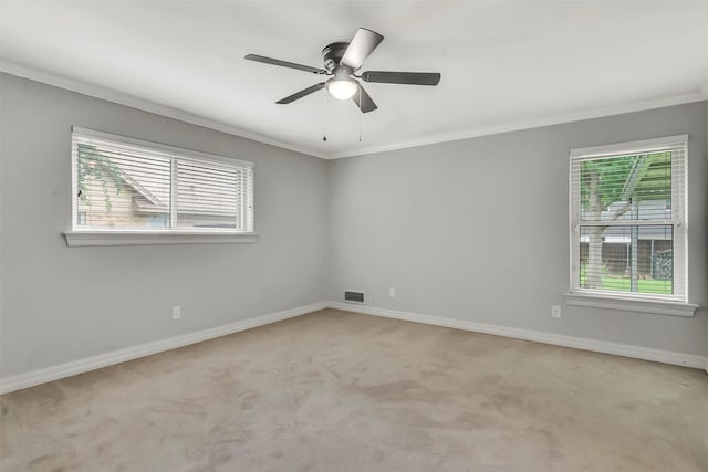 11406 Drummond Dr, Dallas, TX 75228 - carpeted spare room with crown molding, healthy amount of natural light, baseboards, and a ceiling fan