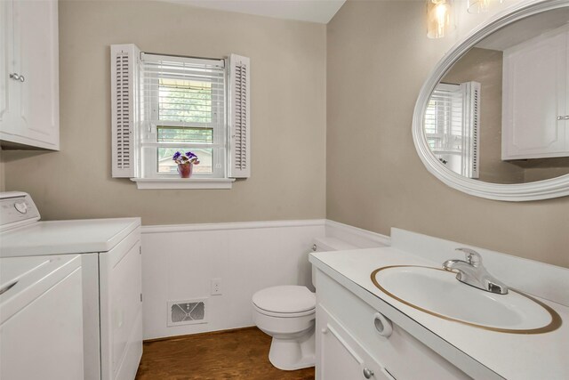 11406 Drummond Dr, Dallas, TX 75228 - bathroom with washer and clothes dryer, toilet, and vanity