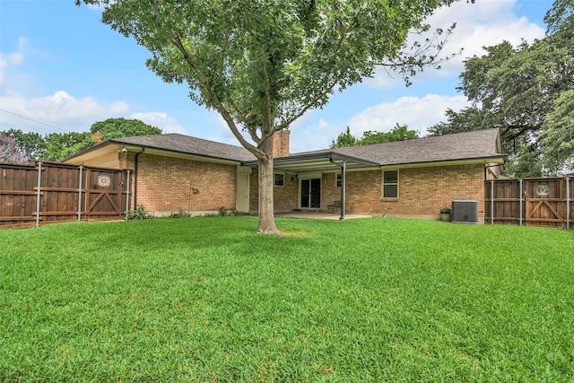 11406 Drummond Dr, Dallas, TX 75228 - rear view of house with brick siding, central AC unit, a chimney, and a patio