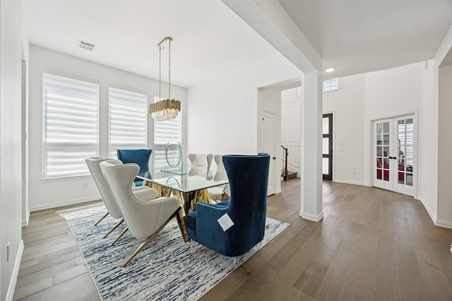 2174 Cloverfern Way, Haslet, TX 76052 - dining area featuring french doors, wood finished floors, a chandelier, and recessed lighting