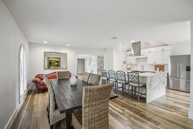 6607 Leameadow Dr, Dallas, TX 75248 - dining area featuring light wood-type flooring, recessed lighting, and baseboards