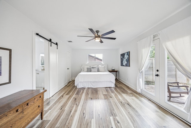 6607 Leameadow Dr, Dallas, TX 75248 - bedroom with a barn door, access to outside, light wood finished floors, baseboards, and ceiling fan