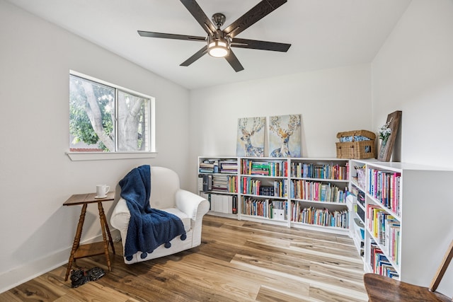 6607 Leameadow Dr, Dallas, TX 75248 - sitting room featuring a ceiling fan, wood finished floors, and baseboards