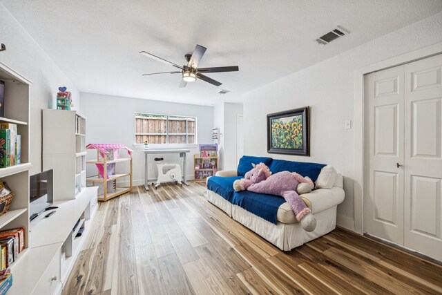 6607 Leameadow Dr, Dallas, TX 75248 - sitting room with a ceiling fan and wood finished floors