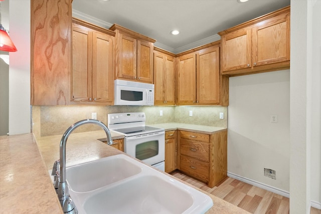 143 Doe Run Rd, Gun Barrel City, TX 75156 - kitchen featuring white appliances, a sink, light wood finished floors, light countertops, and recessed lighting