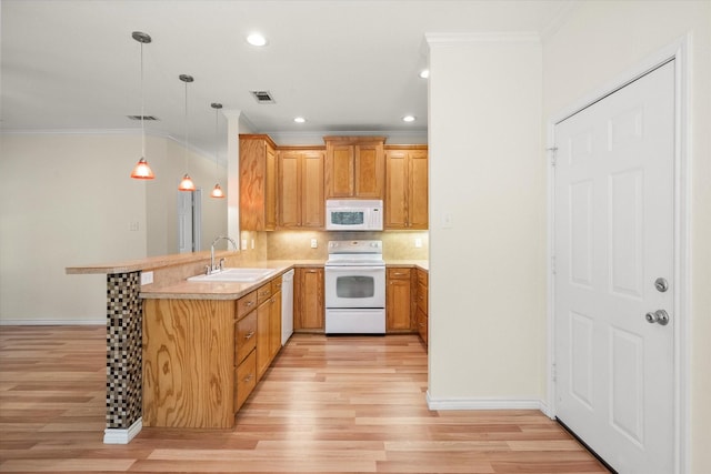 143 Doe Run Rd, Gun Barrel City, TX 75156 - kitchen with white appliances, a sink, crown molding, a peninsula, and light wood-style flooring