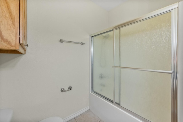 143 Doe Run Rd, Gun Barrel City, TX 75156 - bathroom featuring toilet, shower / bath combination with glass door, and tile patterned floors