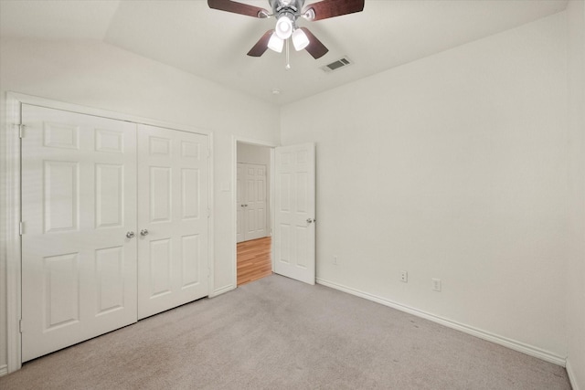 143 Doe Run Rd, Gun Barrel City, TX 75156 - unfurnished bedroom with carpet flooring, a closet, baseboards, a ceiling fan, and lofted ceiling