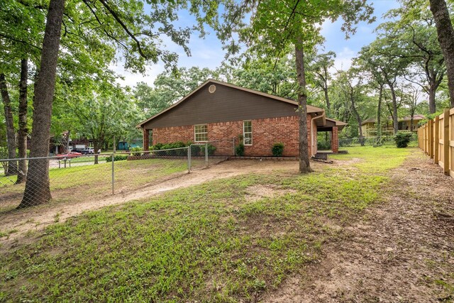 143 Doe Run Rd, Gun Barrel City, TX 75156 - view of home's exterior featuring brick siding
