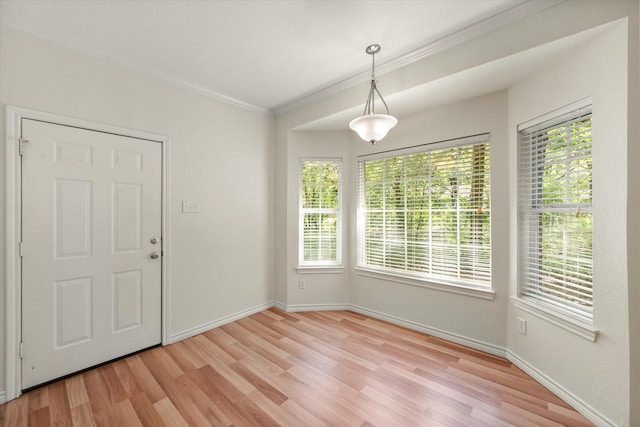 143 Doe Run Rd, Gun Barrel City, TX 75156 - unfurnished dining area with ornamental molding, light wood-style floors, and baseboards
