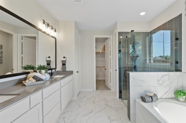 1417 Red Clover Ave, Van Alstyne, TX 75495 - full bath with a shower stall, double vanity, a garden tub, a walk in closet, and marble finish flooring