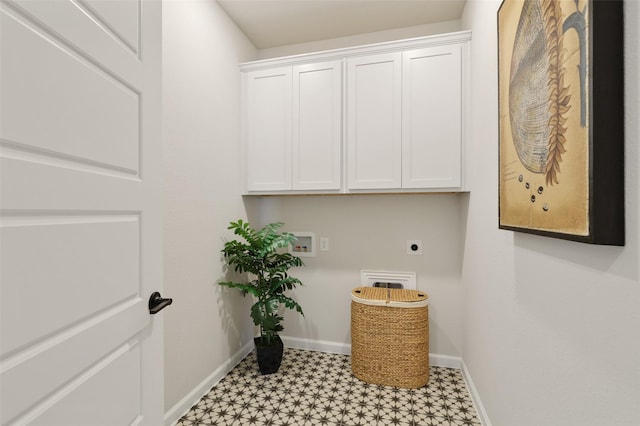 1417 Red Clover Ave, Van Alstyne, TX 75495 - washroom with hookup for an electric dryer, light flooring, baseboards, hookup for a washing machine, and cabinet space