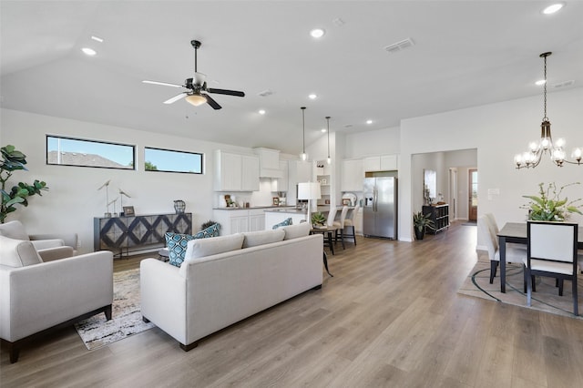 1417 Red Clover Ave, Van Alstyne, TX 75495 - living room featuring lofted ceiling, a chandelier, light wood-style flooring, recessed lighting, and ceiling fan