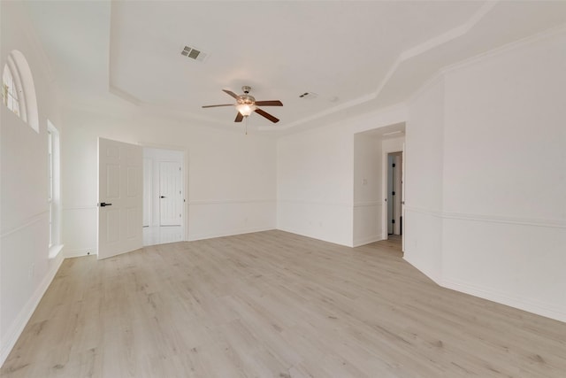 8209 Shoshoni Dr, Arlington, TX 76002 - spare room featuring a tray ceiling, a ceiling fan, and light wood finished floors