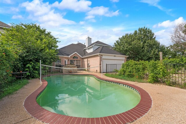 8209 Shoshoni Dr, Arlington, TX 76002 - view of swimming pool with a fenced backyard