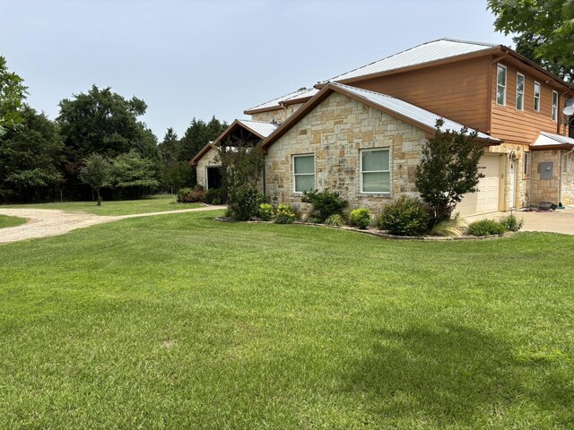 2250 Vz County Road 2301, Canton, TX 75103 - view of front facade with stone siding, concrete driveway, a front yard, a garage, and metal roof