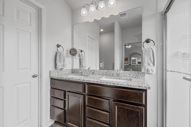 3128 Autry Rd, Lorena, TX 76655 - ensuite bathroom featuring a ceiling fan and double vanity