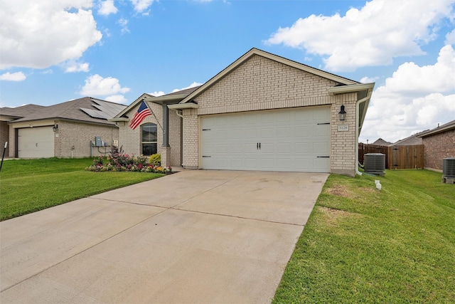 3128 Autry Rd, Lorena, TX 76655 - single story home with central AC unit, concrete driveway, a garage, and brick siding